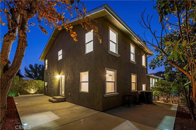 28637 Chiquito Canyon Rd, Castaic, CA 91384 - view of home's exterior with stucco siding, a patio, and central AC unit