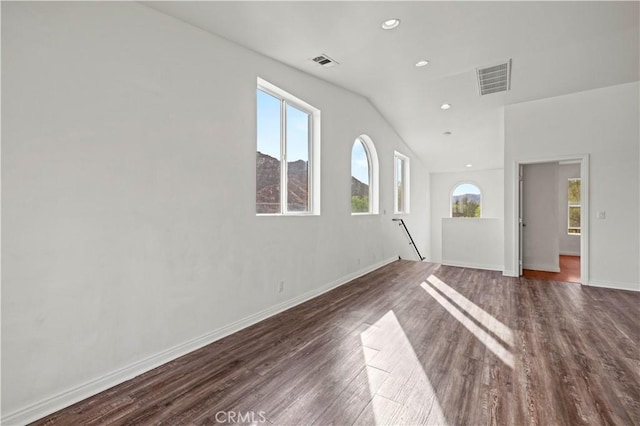28637 Chiquito Canyon Rd, Castaic, CA 91384 - unfurnished living room featuring dark wood-type flooring, baseboards, lofted ceiling, and recessed lighting