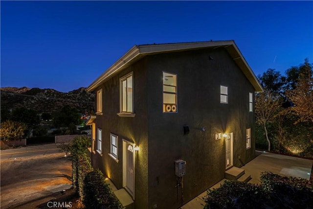 28637 Chiquito Canyon Rd, Castaic, CA 91384 - view of side of home with stucco siding and a mountain view