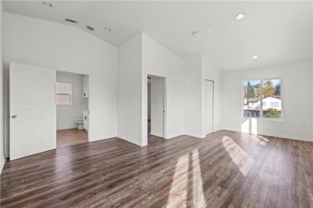 28637 Chiquito Canyon Rd, Castaic, CA 91384 - unfurnished living room featuring dark wood-style floors, vaulted ceiling, baseboards, and recessed lighting