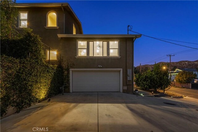 28637 Chiquito Canyon Rd, Castaic, CA 91384 - view of front facade with a garage, concrete driveway, and stucco siding