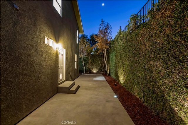 28637 Chiquito Canyon Rd, Castaic, CA 91384 - view of property exterior with stucco siding and a patio area