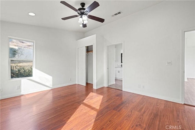 28637 Chiquito Canyon Rd, Castaic, CA 91384 - unfurnished bedroom with wood finished floors, baseboards, ensuite bathroom, and recessed lighting
