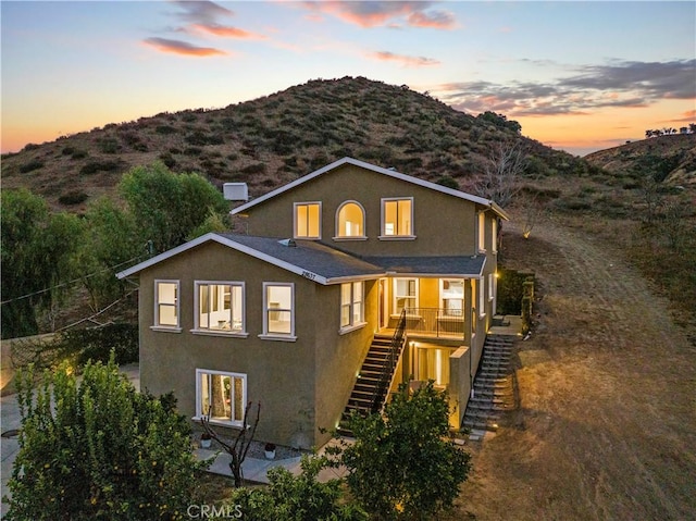 28637 Chiquito Canyon Rd, Castaic, CA 91384 - view of front of home with stairway, stucco siding, and a mountain view