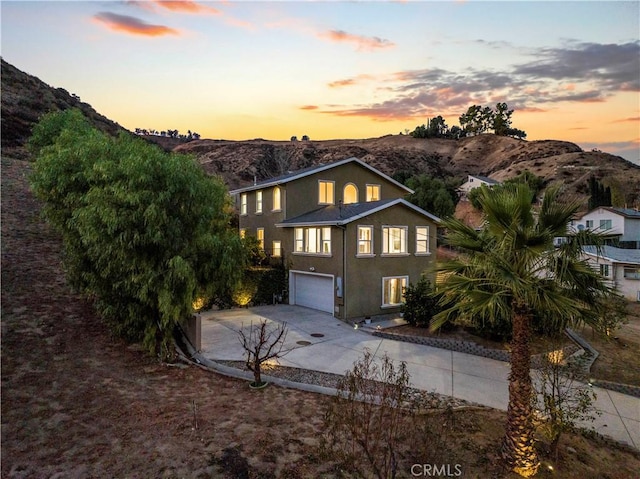 28637 Chiquito Canyon Rd, Castaic, CA 91384 - traditional home featuring driveway, a mountain view, a garage, and stucco siding