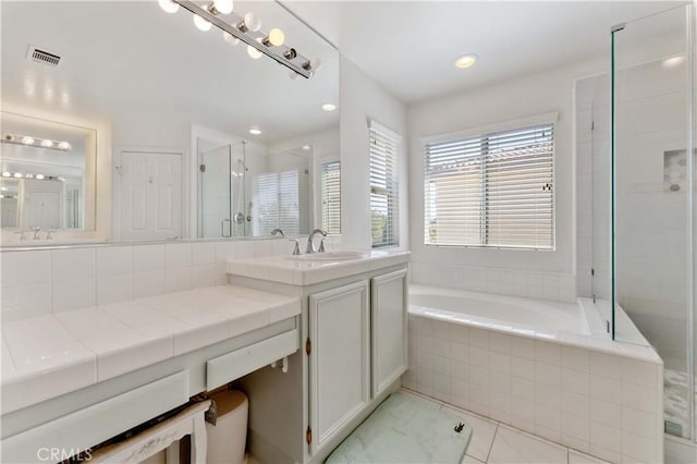 27952 Agapanthus Ln, Valencia, CA 91354 - full bathroom with a shower stall, a garden tub, vanity, and recessed lighting