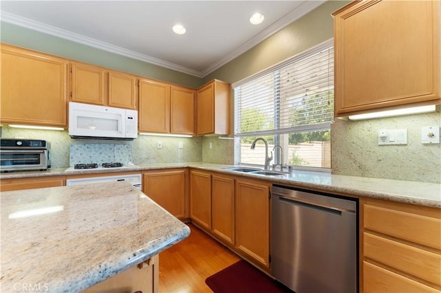 27952 Agapanthus Ln, Valencia, CA 91354 - kitchen with white appliances, a sink, backsplash, light wood-type flooring, and crown molding