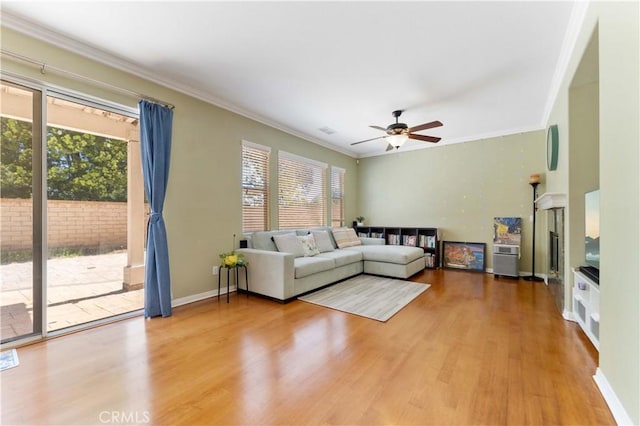 27952 Agapanthus Ln, Valencia, CA 91354 - living room featuring wood finished floors, ornamental molding, and a ceiling fan