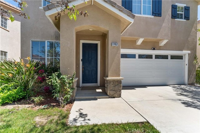 27952 Agapanthus Ln, Valencia, CA 91354 - property entrance with stucco siding and concrete driveway