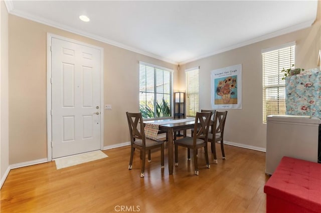 27952 Agapanthus Ln, Valencia, CA 91354 - dining room with light wood-type flooring, ornamental molding, healthy amount of natural light, baseboards, and recessed lighting
