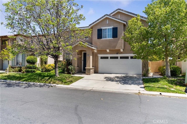27952 Agapanthus Ln, Valencia, CA 91354 - view of front of house featuring stucco siding, concrete driveway, and a garage