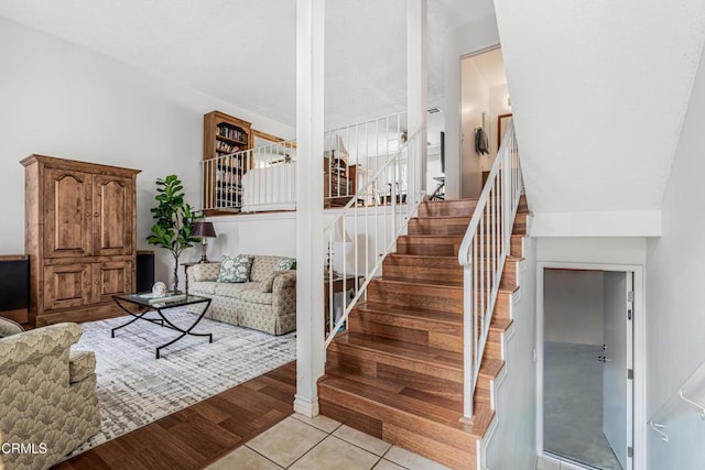 stairs with wood finished floors
