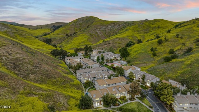 aerial view at dusk of a residential view and a mountain view