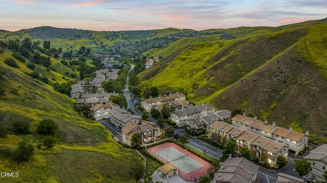 aerial view at dusk of a residential view and a mountain view