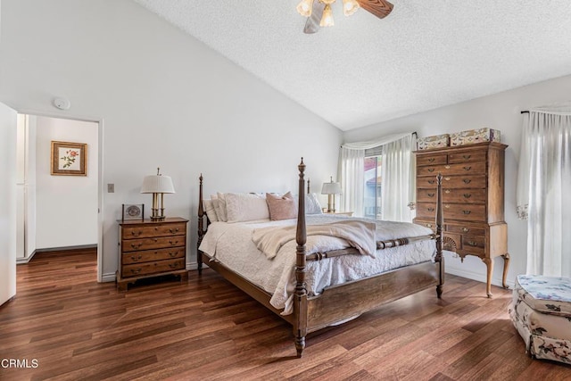 bedroom featuring vaulted ceiling, wood finished floors, a textured ceiling, and a ceiling fan