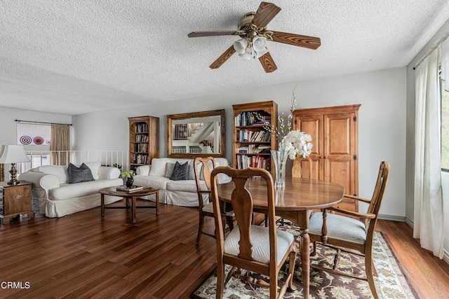 dining room featuring healthy amount of natural light, light wood-type flooring, a textured ceiling, and ceiling fan
