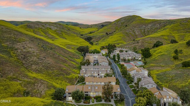 aerial view at dusk of a residential view and a mountain view