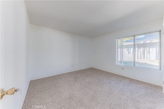 2726 W Orion Ave, Santa Ana, CA 92704 - spare room featuring carpet flooring and baseboards