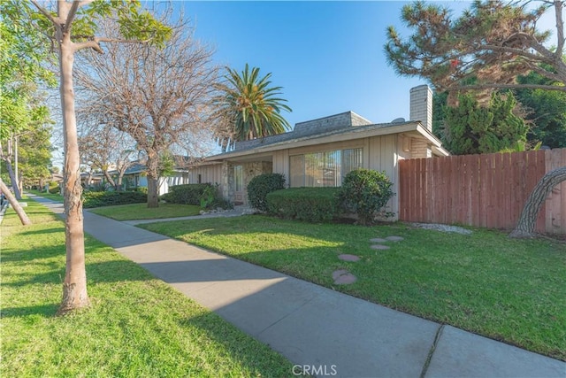 2726 W Orion Ave, Santa Ana, CA 92704 - view of front of home featuring a chimney and board and batten siding