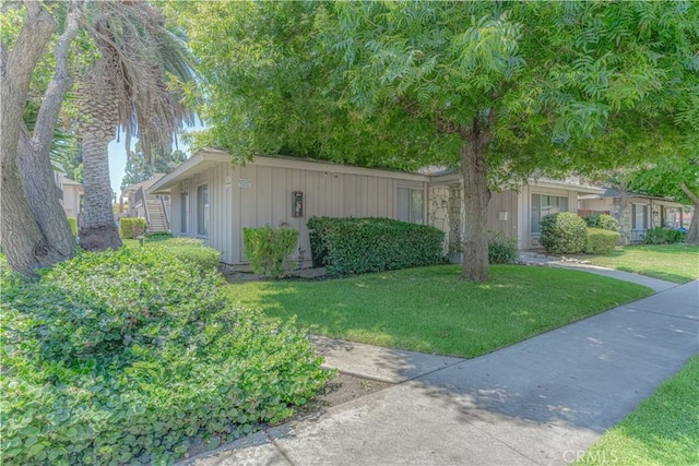 2726 W Orion Ave, Santa Ana, CA 92704 - view of front of property featuring board and batten siding and a front lawn
