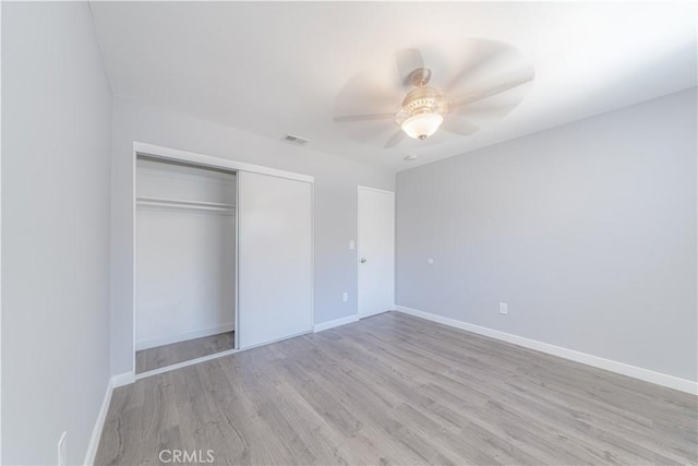 2726 W Orion Ave, Santa Ana, CA 92704 - unfurnished bedroom with wood finished floors, a closet, and ceiling fan
