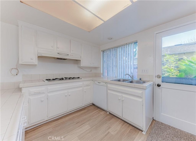 2726 W Orion Ave, Santa Ana, CA 92704 - kitchen featuring tile counters, under cabinet range hood, white appliances, white cabinetry, and light wood finished floors