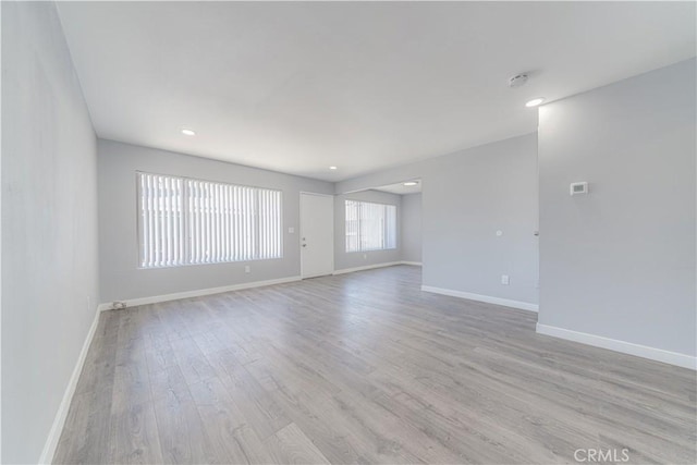 2726 W Orion Ave, Santa Ana, CA 92704 - empty room featuring light wood finished floors, a smoke detector, and recessed lighting