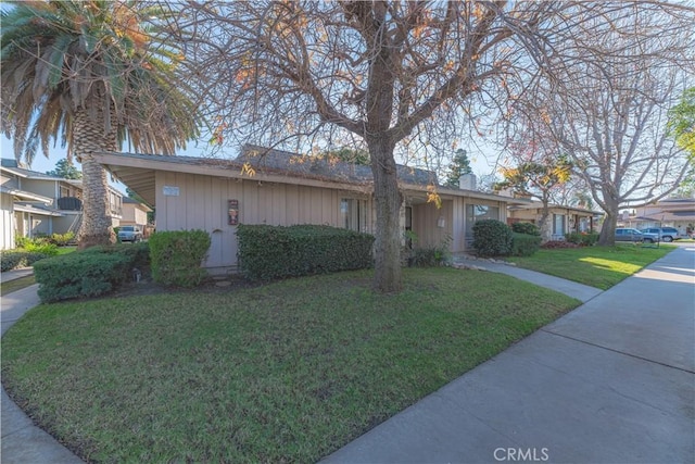 2726 W Orion Ave, Santa Ana, CA 92704 - ranch-style home with board and batten siding and a front yard