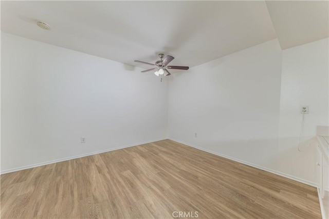 2726 W Orion Ave, Santa Ana, CA 92704 - spare room with ceiling fan, light wood finished floors, and a smoke detector