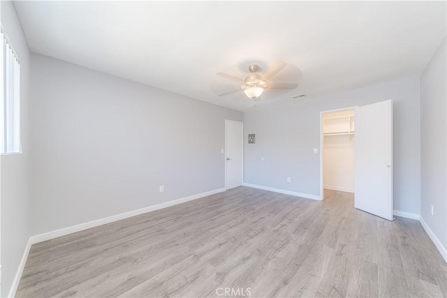 2726 W Orion Ave, Santa Ana, CA 92704 - unfurnished bedroom with light wood finished floors, multiple windows, a closet, and ceiling fan
