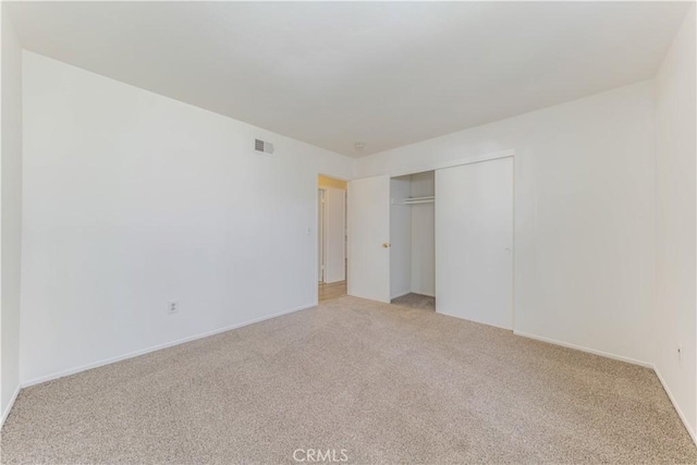 2726 W Orion Ave, Santa Ana, CA 92704 - unfurnished bedroom with light carpet and a closet