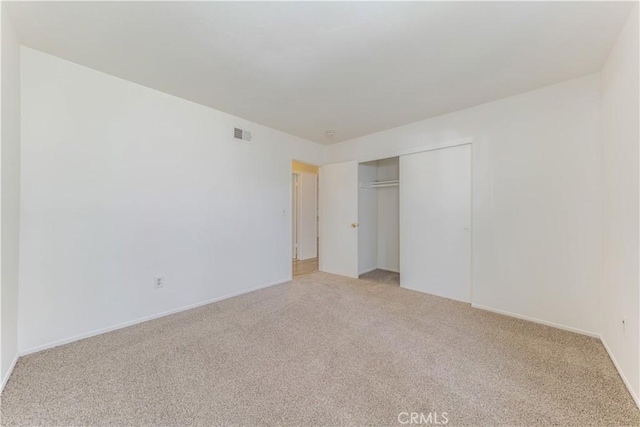 2726 W Orion Ave, Santa Ana, CA 92704 - unfurnished bedroom featuring light carpet and a closet