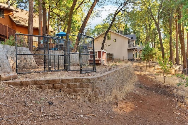 14177 Racine Cir, Magalia, CA 95954 - view of side of home featuring fence, a playground, a shed, and an outbuilding