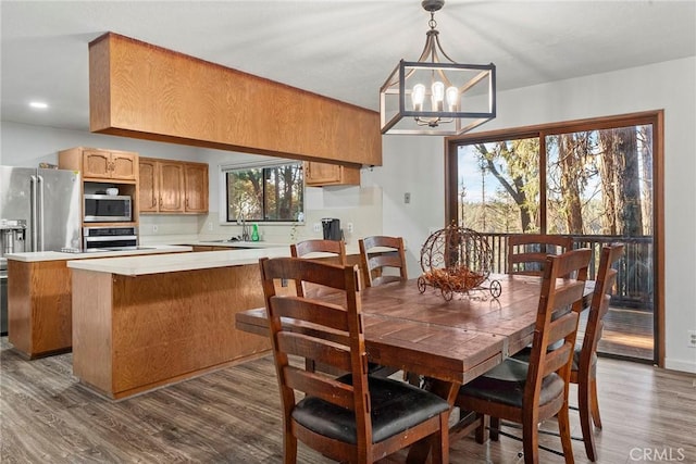 14177 Racine Cir, Magalia, CA 95954 - dining area featuring a chandelier and dark wood-type flooring