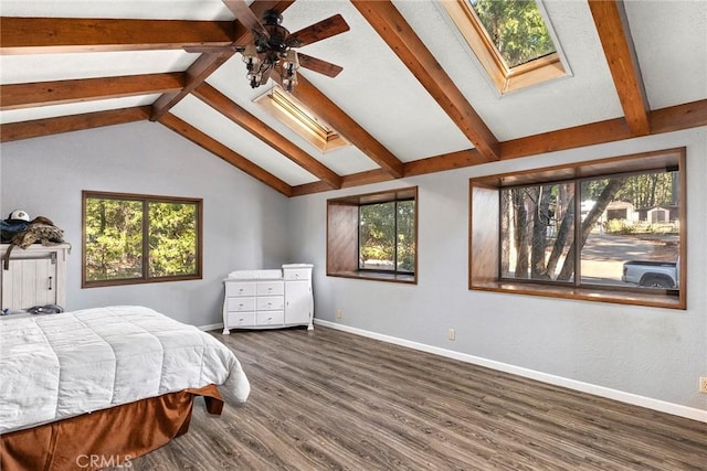 14177 Racine Cir, Magalia, CA 95954 - bedroom featuring a skylight, multiple windows, baseboards, and dark wood-style floors