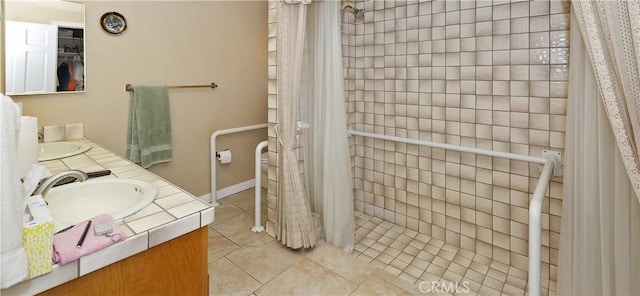 20407 Eyota Ln, Apple Valley, CA 92308 - full bath featuring tile patterned floors, double vanity, tiled shower, and toilet