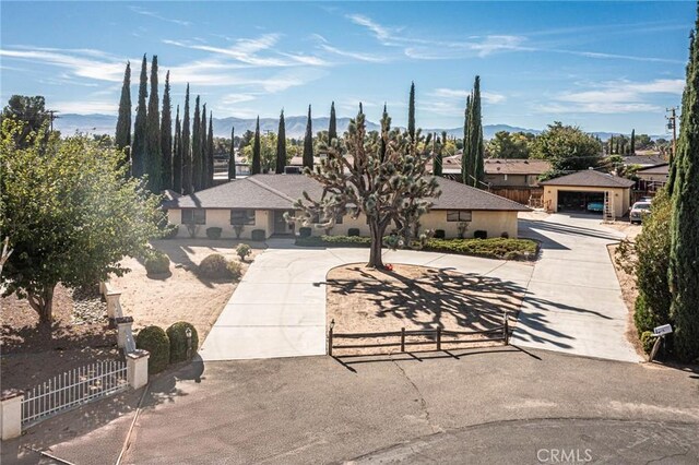20407 Eyota Ln, Apple Valley, CA 92308 - view of front facade featuring fence and a mountain view