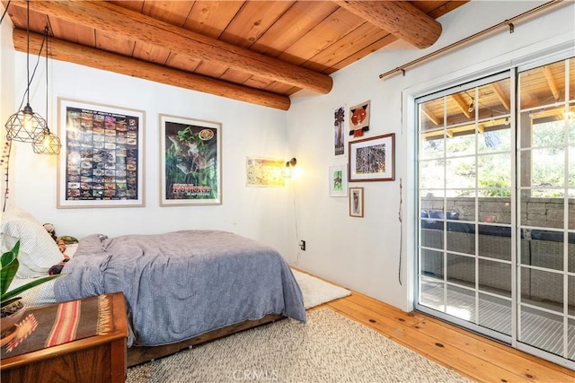 7900 San Clemente Ave, Atascadero, CA 93422 - bedroom with wood finished floors, wood ceiling with exposed beams, and access to outside