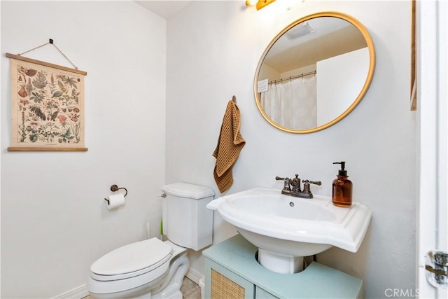 7900 San Clemente Ave, Atascadero, CA 93422 - full bathroom with baseboards, toilet, and a sink