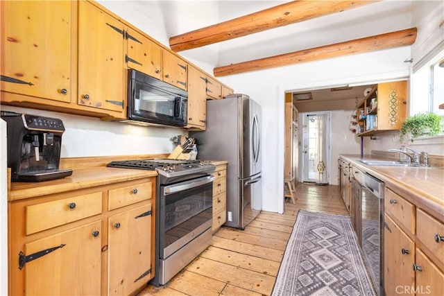 7900 San Clemente Ave, Atascadero, CA 93422 - kitchen with stainless steel appliances, light wood finished floors, light countertops, healthy amount of natural light, and beamed ceiling