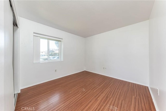 2619 W Aurora St, Santa Ana, CA 92704 - unfurnished room with wood finished floors and baseboards