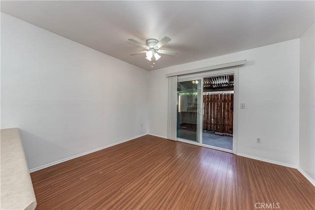 2619 W Aurora St, Santa Ana, CA 92704 - spare room featuring ceiling fan, wood finished floors, and baseboards