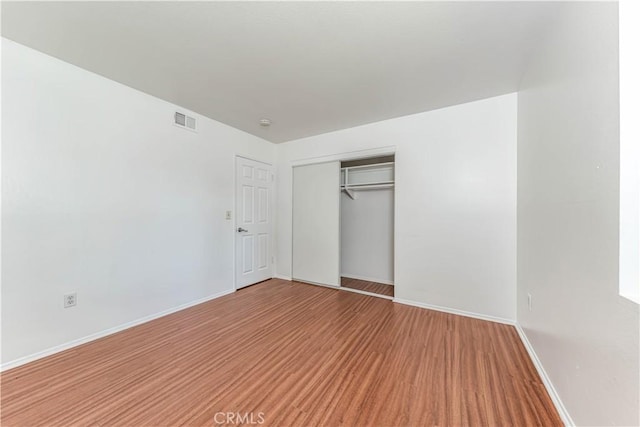 2619 W Aurora St, Santa Ana, CA 92704 - unfurnished bedroom with wood finished floors and a closet