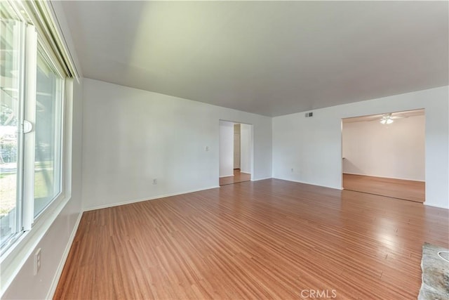 2619 W Aurora St, Santa Ana, CA 92704 - empty room featuring wood finished floors and a ceiling fan