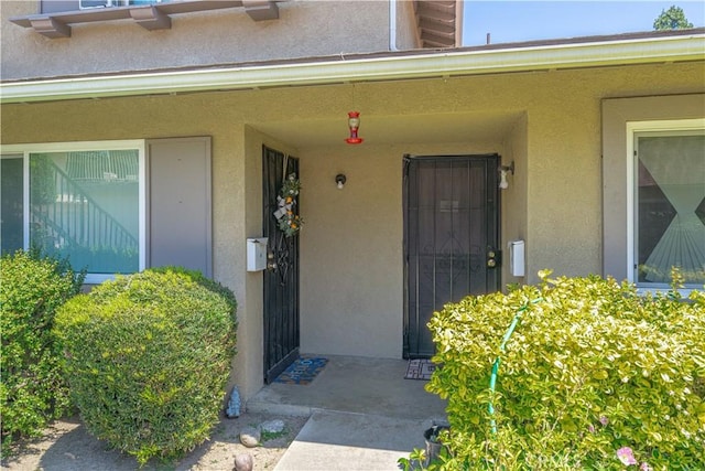 2619 W Aurora St, Santa Ana, CA 92704 - doorway to property with stucco siding