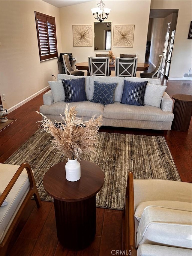 228 Pisa Ct, Merced, CA 95341 - living area with wood-type flooring, baseboards, and a chandelier