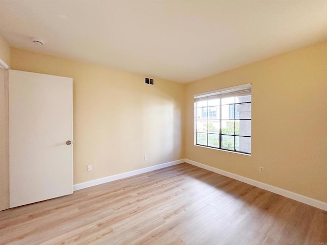 13272 Wimberly Sq Unit 219, San Diego, CA 92128 - unfurnished room featuring light wood-type flooring and baseboards