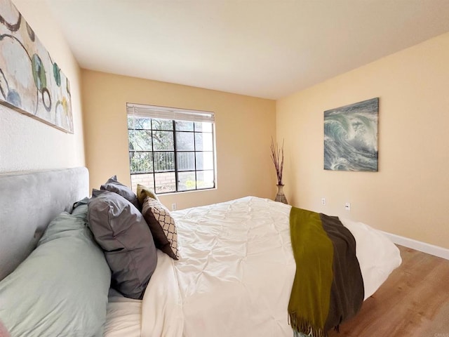 13272 Wimberly Sq Unit 219, San Diego, CA 92128 - bedroom featuring wood finished floors and baseboards