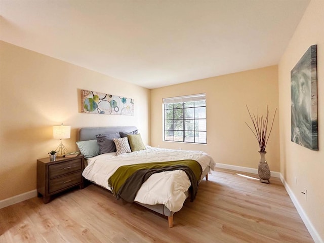 13272 Wimberly Sq Unit 219, San Diego, CA 92128 - bedroom with light wood finished floors and baseboards