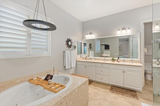 3482 Corte Fortuna, Carlsbad, CA 92009 - bathroom featuring tile patterned floors, double vanity, a whirlpool tub, and toilet